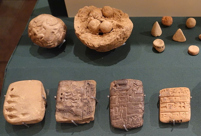 Clay bullae, tokens and cuneiform script (from an exhibition at the University of Chicago Oriental Institute)
